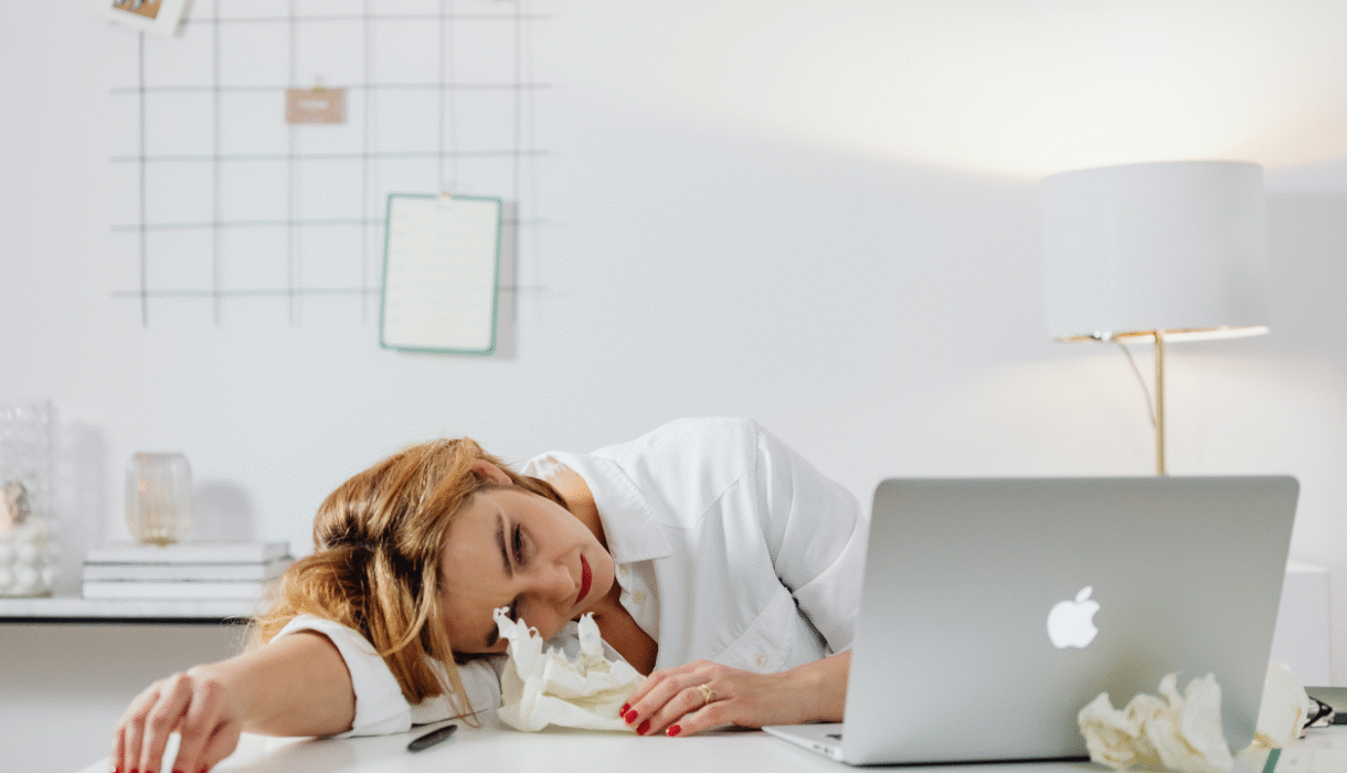 Entrepreneur working on social media from a laptop at home, representing how decision fatigue and social media can feel overwhelming.