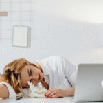 Entrepreneur working on social media from a laptop at home, representing how decision fatigue and social media can feel overwhelming.